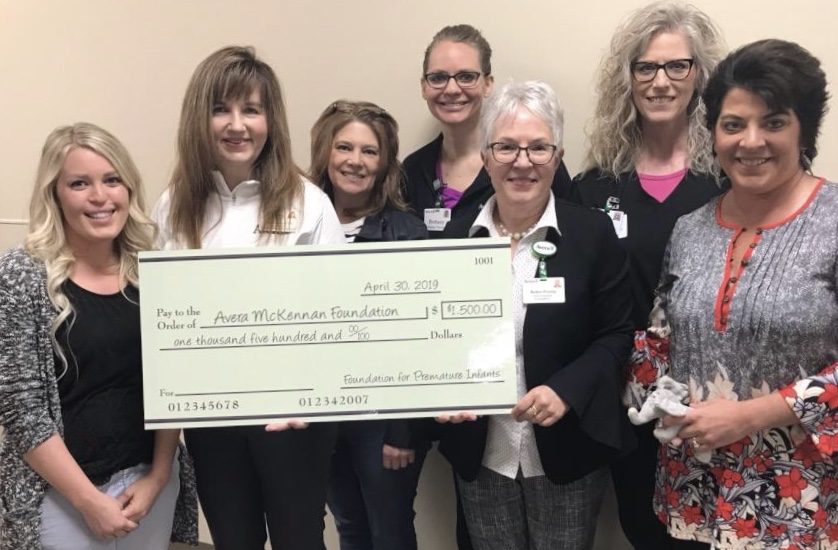 Lisa Chiburis Bader Presents Check to Avera McKennan Hospital NICU